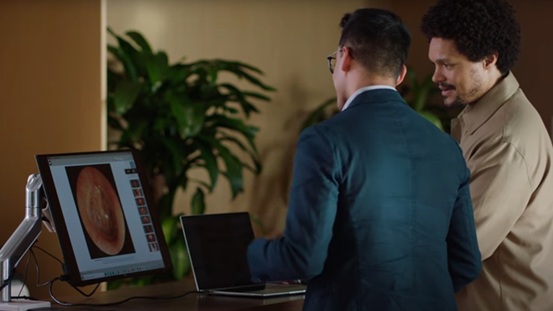 Trevor Noah looking at inner ear imaging on computer screen